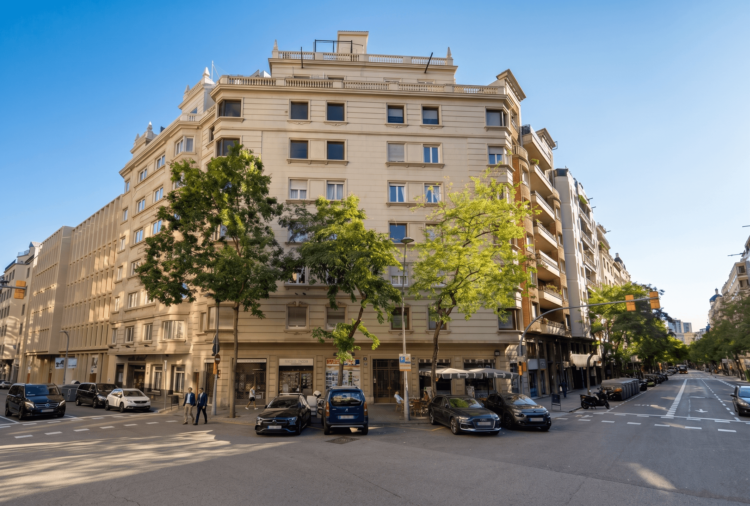 Wide shot of the Barcelona office space — natural light, warm interiors, character of the Eixample or the neighbourhood